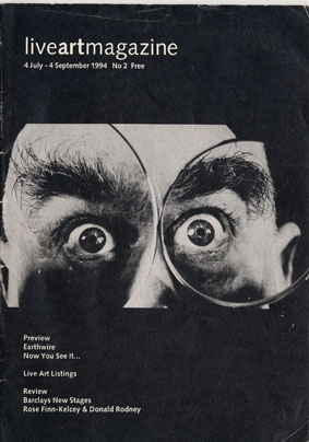 Example cover of Live Art Archive Magazine with a black background, white text, and a photograph of a male face with the eyes magnified
